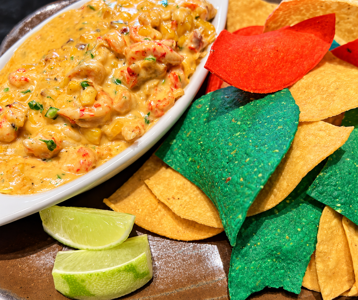 Crawfish Esquites with colorful tortilla chips